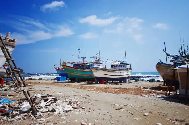 Photo of Fishing boats in Dondra harbor in Sri Lanka.