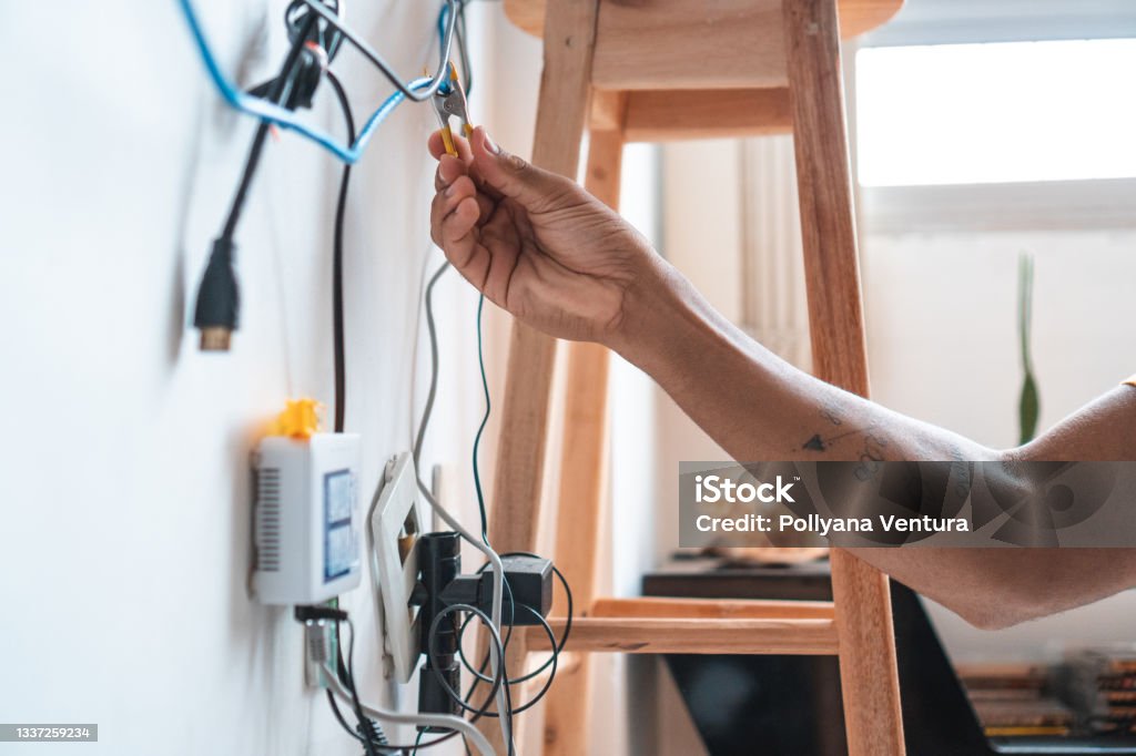 Electrician working home client Man, Electrician, Repairman, Manual work, Service Cable Stock Photo