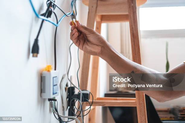 Electrician Working Home Client Stock Photo - Download Image Now - Cable, Living Room, Television Set