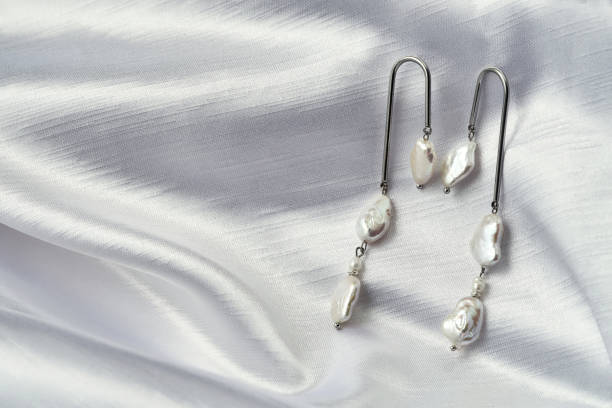 istock Handmade dangle earrings with shiny pearls 1337260564