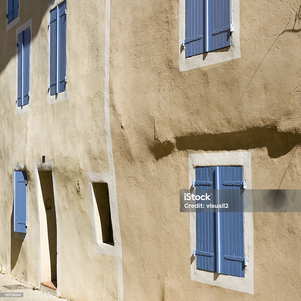French House with colored window shutters France. Provence Alley Stock Photo