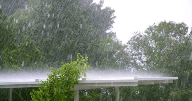 istock Raining over a white roof in a hurricane storm 1337262252