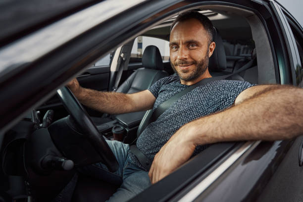 istock Friendly young driver waiting for the passengers 1337264650