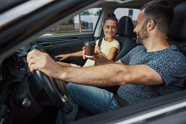 istock Enjoying hot beverage with wife before driving 1337264658