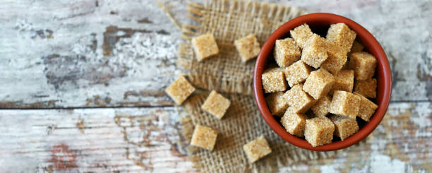 istock Brown sugar crystals cubes in a bowl. 1337264700