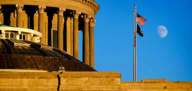 idaho state capitol building governing government dome structure legal laws moon sky flags - idaho state capitol imagens e fotografias de stock