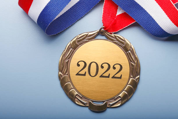 istock Gold Medal Engraved With  The Year 2022 On Blue Background 1337266546