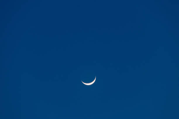 istock Crescent moon on blue sky. Look like a smile on a good day. 1337267751