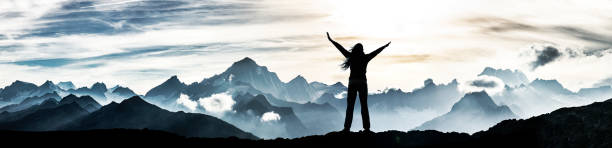 istock Woman on a summit in victory pose 1337269798