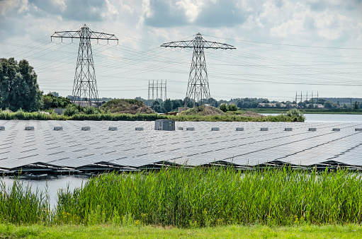 Zwolle, The Netherlands, August 4, 2021: large field of solar panels floating on artificial lake Sekdoorne Plas, created for gravel extraction
