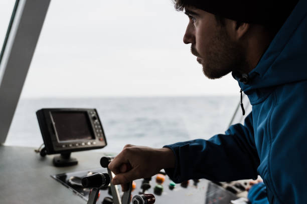 istock Young skipper man sailing a boat having fun during summer vacation - Focus on face 1337270535