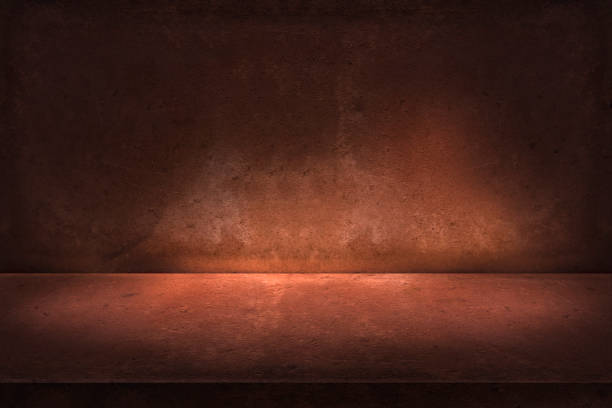 istock abstract orange rock wall, and studio room, interior texture for display products.  lighting and shadow on wall background 1337272572