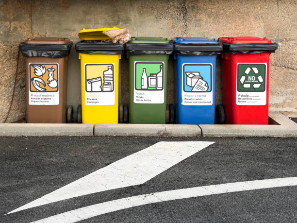 istock Five garbage recycling bins on the street 1337272730