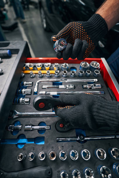 istock Technician holding socket wrench and head in hands 1337272760