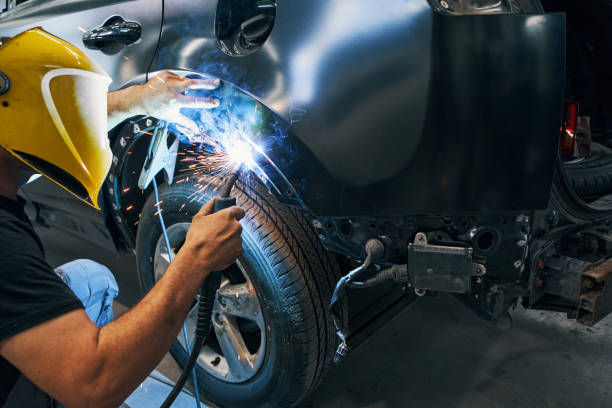 istock Man working with welding machine on wheel arch cover 1337272774