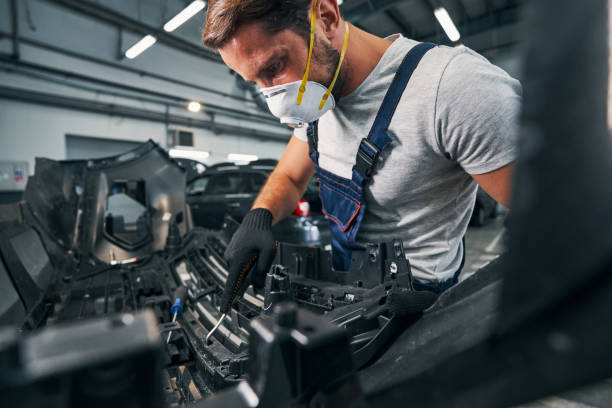 istock Repairman checking spare part condition with wrench 1337273452