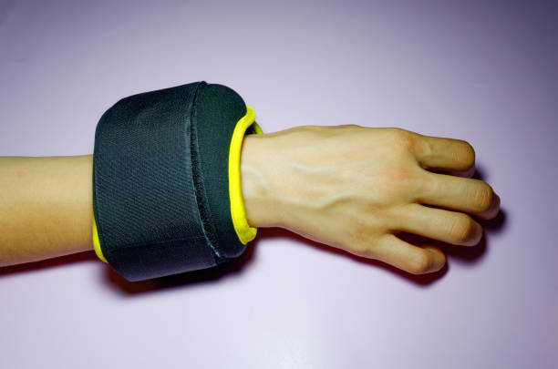 istock black with yellow fabric wrist ankle weights on pink background 1337275121