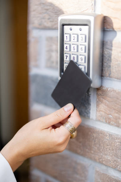 istock Attaching card to the electronic reader to access the office or apartment 1337276113