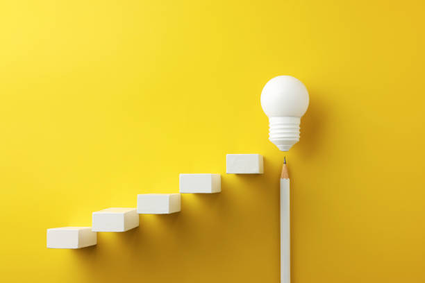istock rising line graph on wooden cube blocks and light bulb, business concept 1337276128