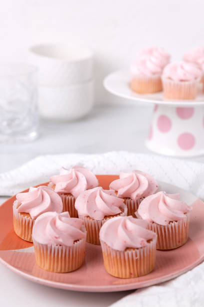 istock A plate of pink mini cupcakes in a white kitchen setting 1337277676
