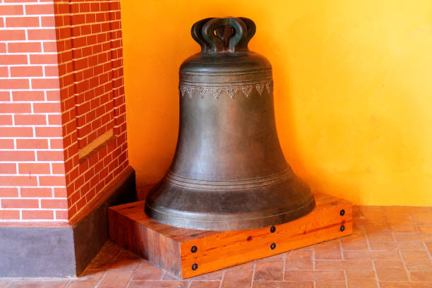 istock bell resting on a wooden plank 1337277906