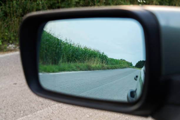 istock Leaving the corn field, the reflection in the car rear-view mirror 1337280033