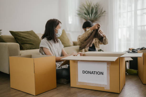 istock Young couple preparing donation and charity. 1337281250