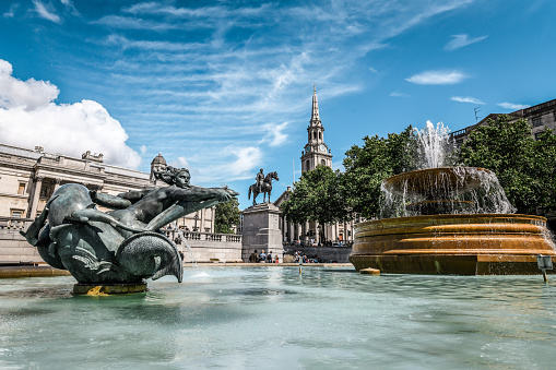 A view of the dolphin-shaped fountain in Trafalgar Square, a very popular place worth visiting in London.