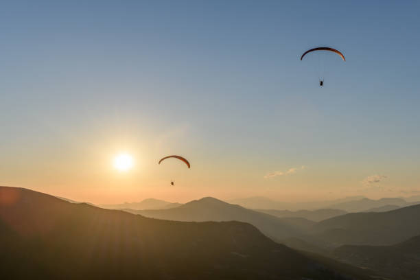 istock Paragliding flight in the air over the mountains. 1337282044