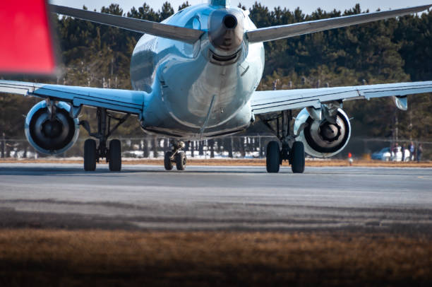 istock airplane taxing on the runway. 1337283882