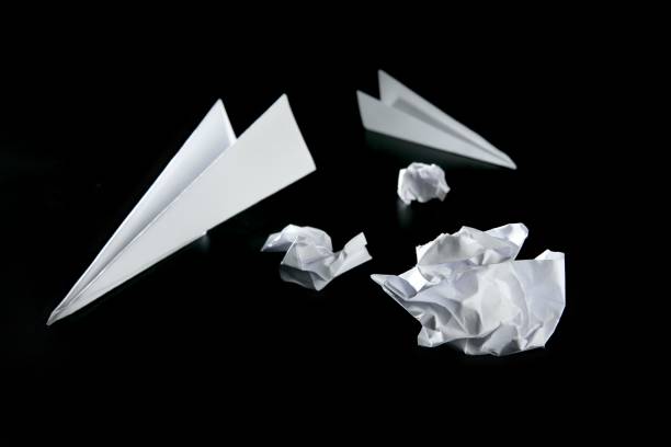 istock trash paper and air plane 1337285369