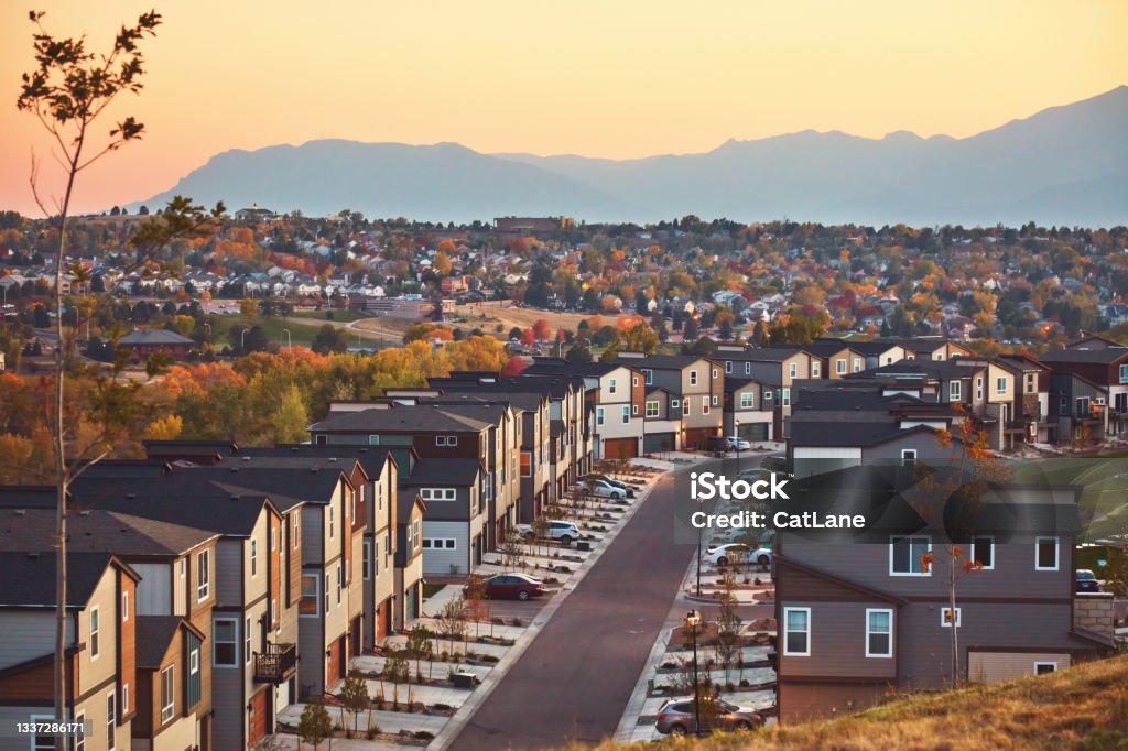 Residential Community in Western USA with Modern Homes at Sunrise and Mountains in Background Colorado Springs Stock Photo