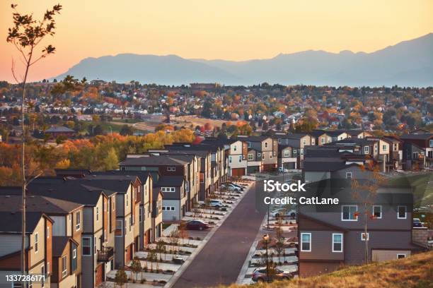 Residential Community In Western Usa With Modern Homes At Sunrise And Mountains In Background Stock Photo - Download Image Now