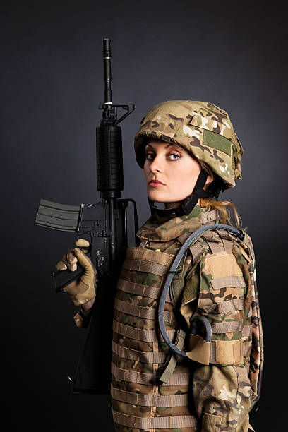 istock Beautiful army girl with rifle 133728630