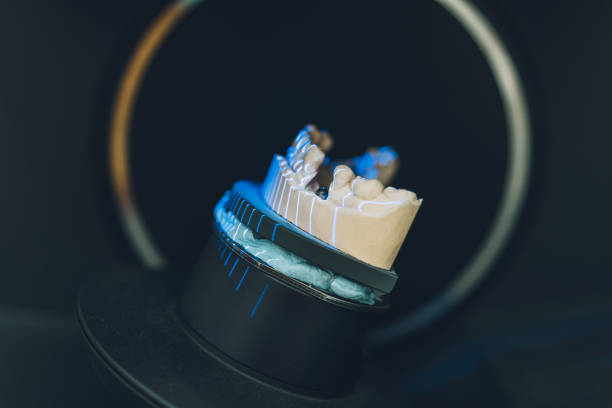 istock Inside a scanner with a dental mould being scanned with laser rays in a laboratory 1337286512