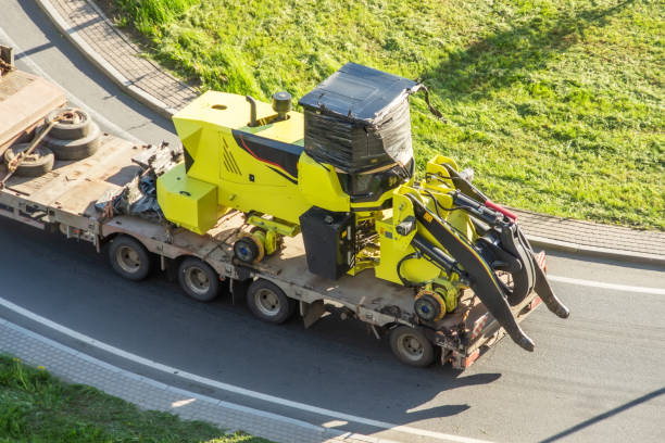 truck carrying machinery on its back