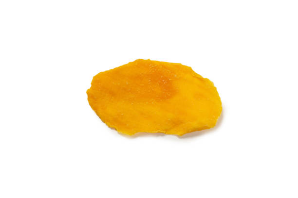 istock Dry tasty mango slices isolated on a white background. 1337287792