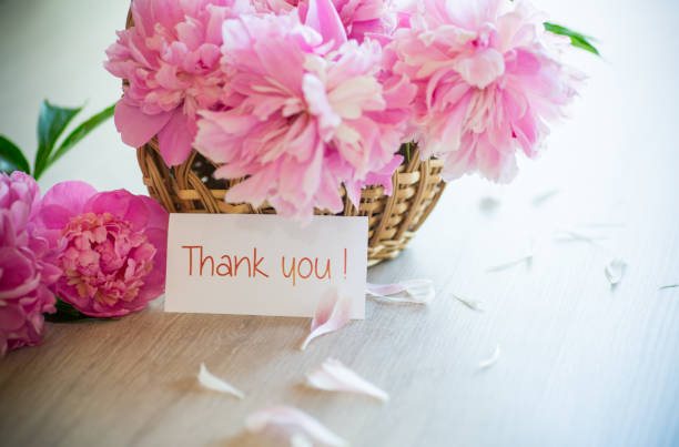 istock several branches of blooming pink peonies on a wooden table 1337287847