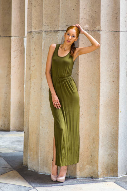 istock Young woman standing outdoors in New York City, looking forward 1337289401