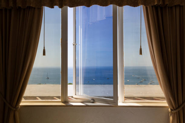 istock Windows with curtains, with a view to the sea 1337292128