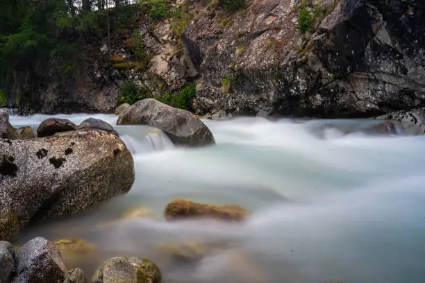 A river that has forced its way through the mountains. Photo taken with a slow shutter speed so that the water is flattened.