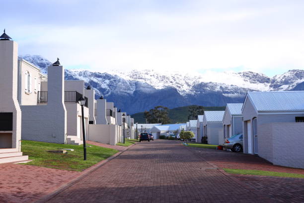 istock A view past some houses towards snow covered peaks 1337295844