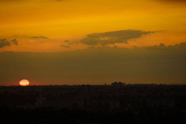 istock Dawn or sunset over a small city with multi-story buildings 1337296430