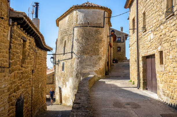 September 16, 2018 - Ujue, Spain: one person walking in the ancient streets of the medieval town of Ujue, Navarra, Spain
