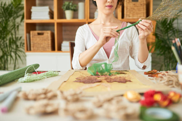 istock Woman Decorating Dried Wildflowers 1337299724