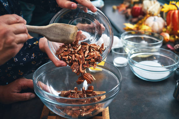 istock Mother and Teens Preparing Pecan Pie for the Holidays 1337300694