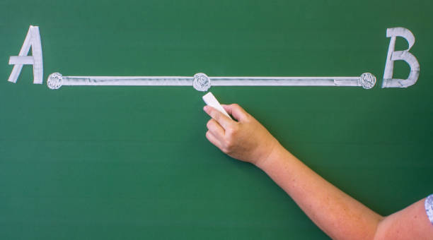 istock segment with two dots drawn in white chalk on a green blackboard 1337303121