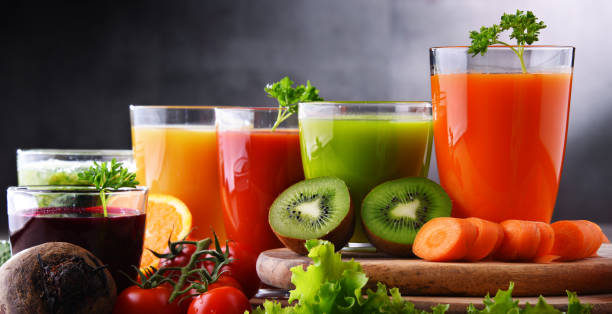 istock Glasses with fresh organic vegetable and fruit juices 1337305834