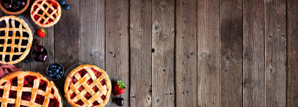 istock Homemade fruit pies corner border over a rustic wood banner background 1337310438