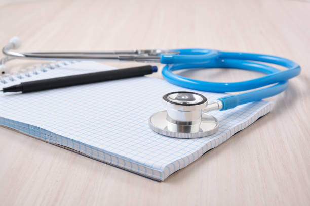 istock medicines, pills, medical stethoscope and notepad for notes on the table, disease diagnosis concept 1337313310